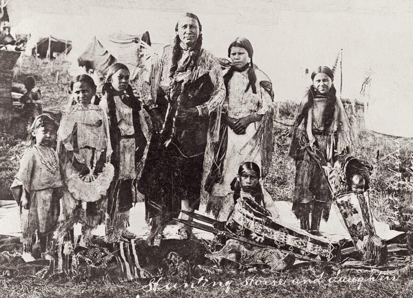 Native American man with his daughters